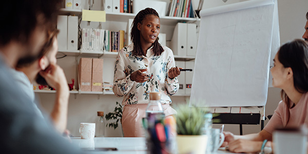 person presenting to colleagues